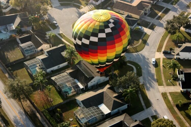 A hot air balloon floating above Orlando's villa. 